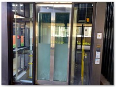 Glass passenger stretcher lift